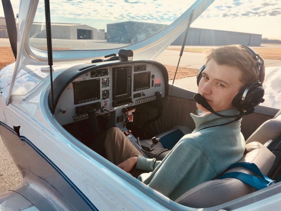 Preparing for takeoff, Hammett Anderson sits in the cockpit before taking to the skies.