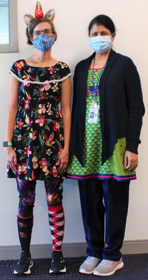 Teachers Christi Dunlap and Samina Alimohamed show their excitement for Tacky Tuesday.