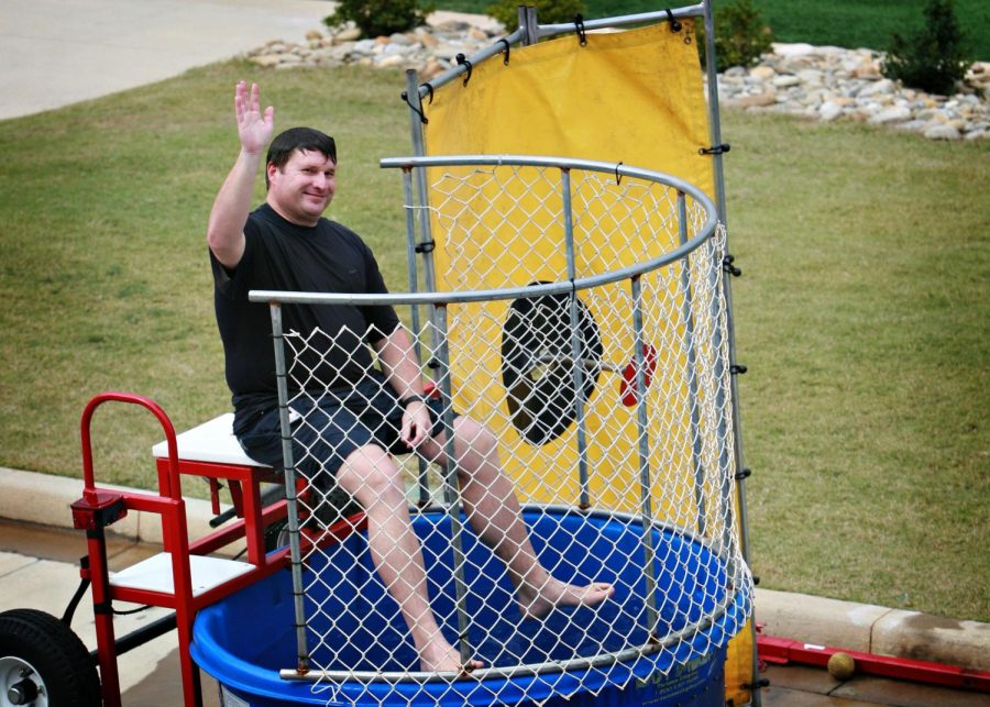 Assistant Principal David Lawson waves before he gets dunked by students on Friday Fun Lunch.