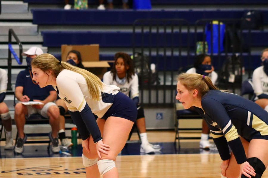 Preparing to return a serve, captains Madison Shaw (12) and Gracie Eubanks (12) are focused on success in their last year.