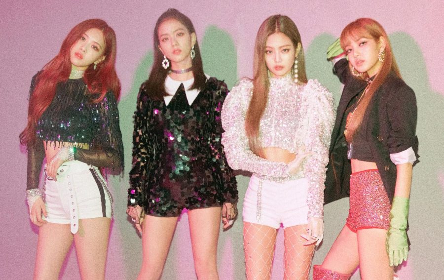 With their glittery costumes and pastel pink highlights, the K-Pop members of BLACKPINK pose for a picture. The group has a huge American following and performed at Coachella in 2019. 