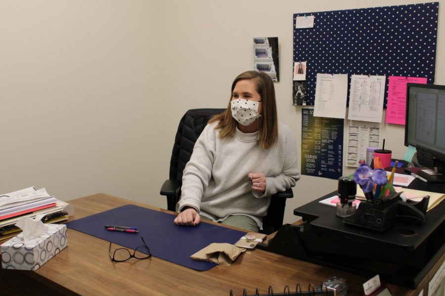 Guidance counselor, Lauren Jones, speaks to a student in her office.