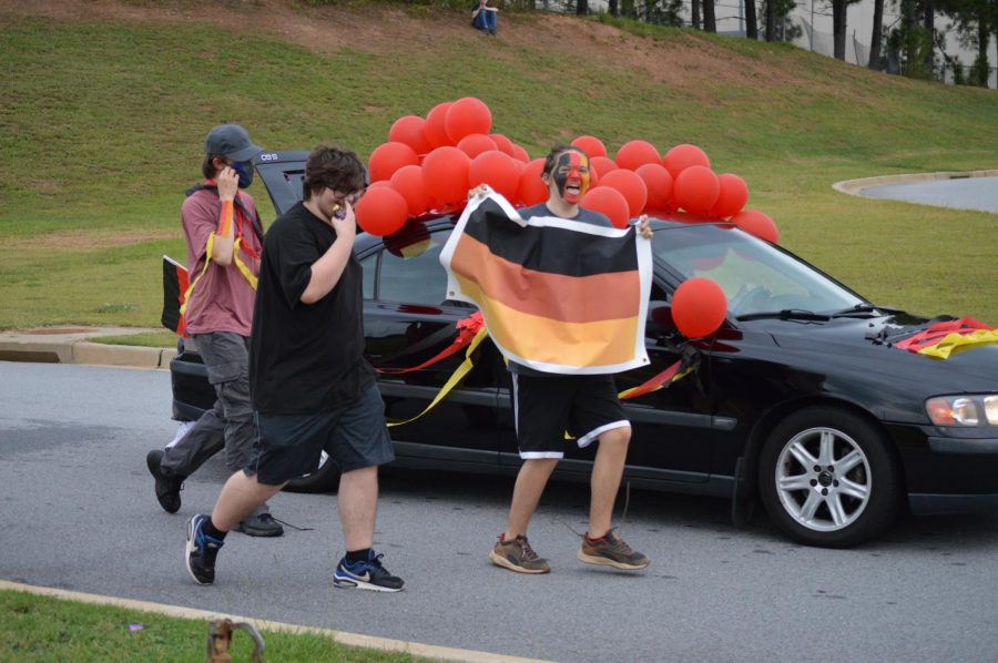 The German Club celebrates during the Homecoming parade.