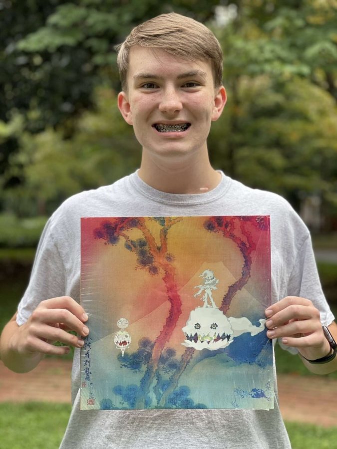 Florian Sloan (12) poses with a vinyl of KIDS SEE GHOSTS.