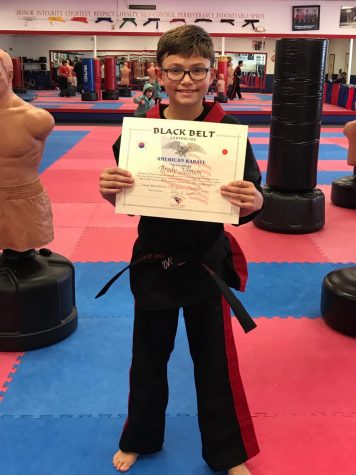 Brady Johnson received his black belt certificate at age 10.