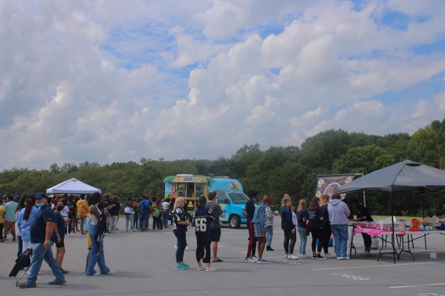 Students wait in line for various food trucks during Fun Lunch.