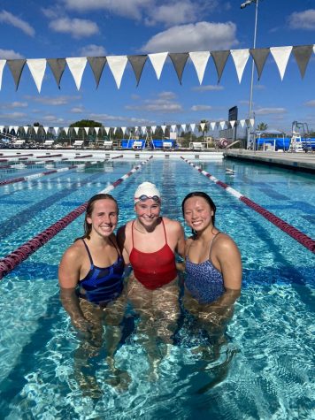 Kirsti McEnroe poses with other swimmers at the National Select Swimming camp.