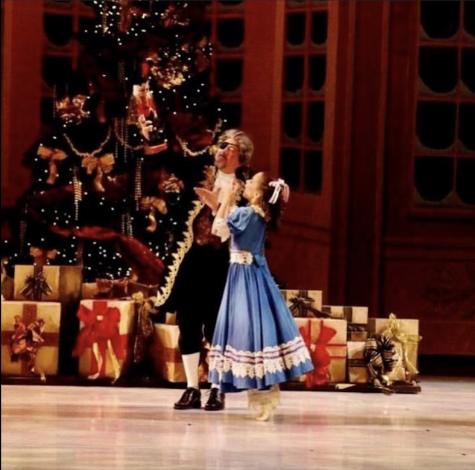 Clara and her uncle dance after Clara receives her nutcracker.
