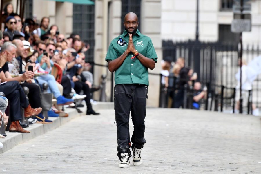 Abloh walks down the runway in a 2019 Louis Vuitton fashion show in Paris.