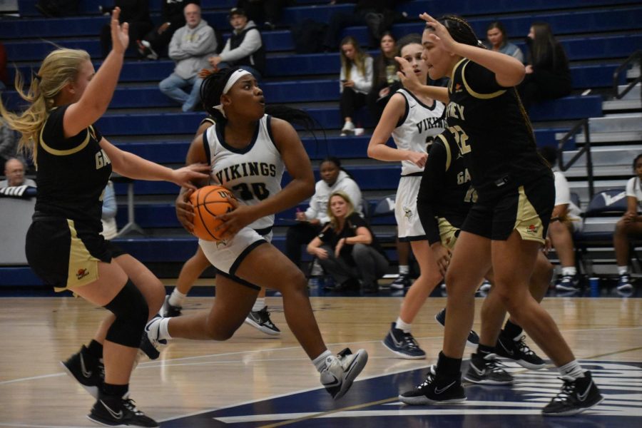 Antasia Brewton (11) drives to the paint for a lay up.