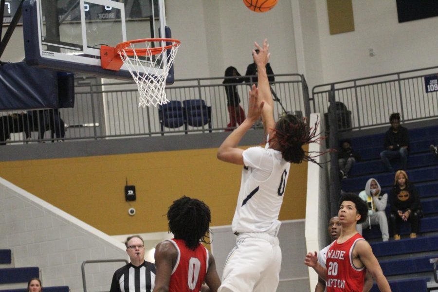 Malachi Hiers (12) sets up for a basket against Wade Hampton.