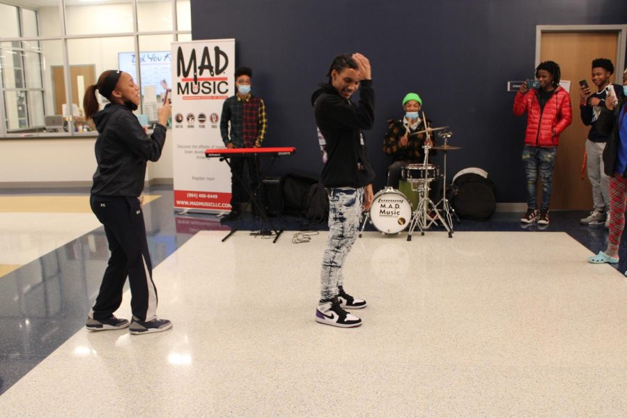 Kavon Peterson (11) dances to M.A.D. Musics performance. 