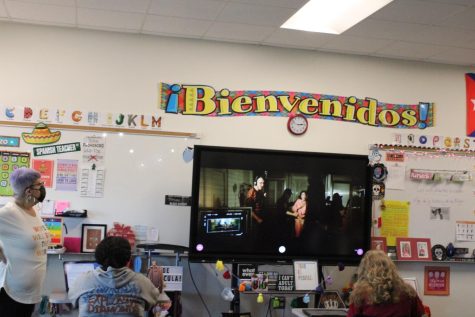 Spanish teacher Neyda Mora, shows her first period class the songs Idiota (7) vs.Epiphany (10) for the daily Locura de Marzo competition.