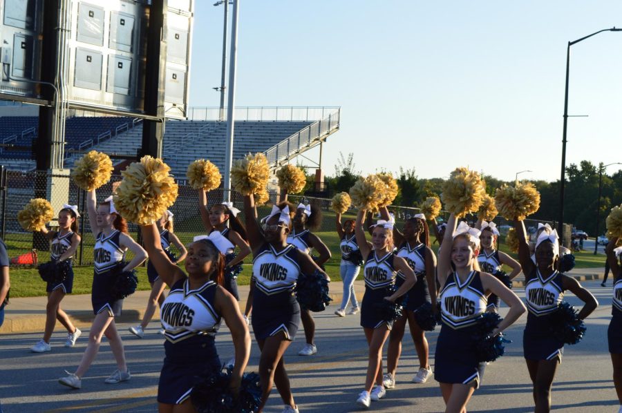 Vikings cheerleaders pep up the crowd at the Homecoming parade.