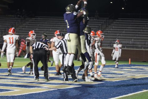 After scoring a touchdown against Mauldin, two Vikings celebrate in the endzone.