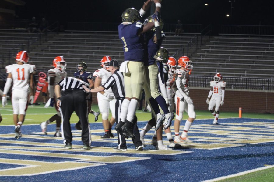 After+scoring+a+touchdown+against+Mauldin%2C+two+Vikings+celebrate+in+the+endzone.