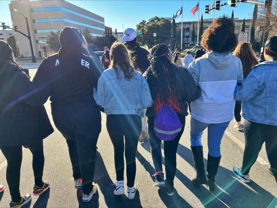 Spartanburg High Schools Black History Club members join arms during the Unity Walk.