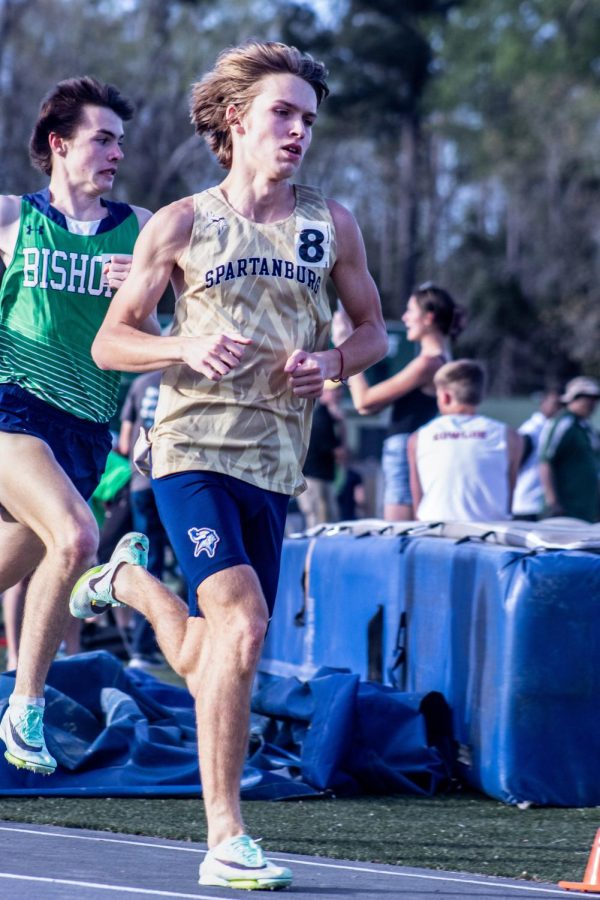 George Proctor(11) races in the 800m run during the Low Country Invitational.