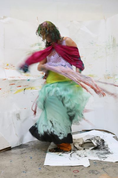 Teagan McEnroe (11) spins to create a painting at the Art Institute of Chicago.