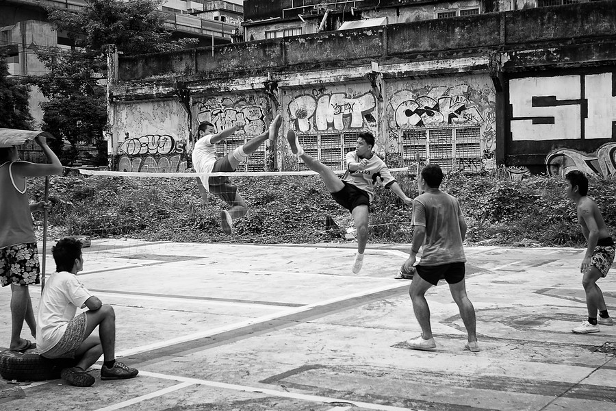 A group of friends playing Sepak Takraw in Bangkok, Taiwan.