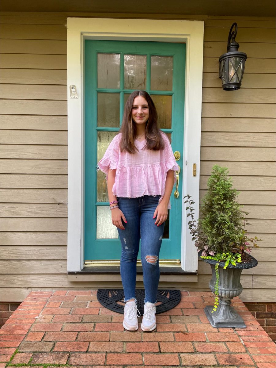 About to head out the door, Reese Sullivan (9) snaps a quick first day of high school picture.