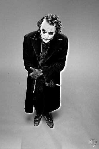 Heath Ledger posing for a picture as The Joker