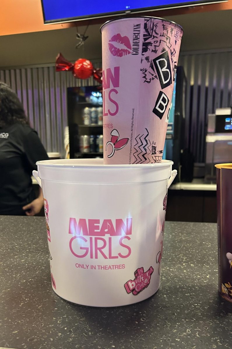 Mean Girls display at NCG features a specialty cup and popcorn bucket.