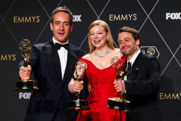 Matthew Macfadyen, Sarah Snook, and Kieran Culkin stand with their Emmys Awards for their roles in the TV show Succession.