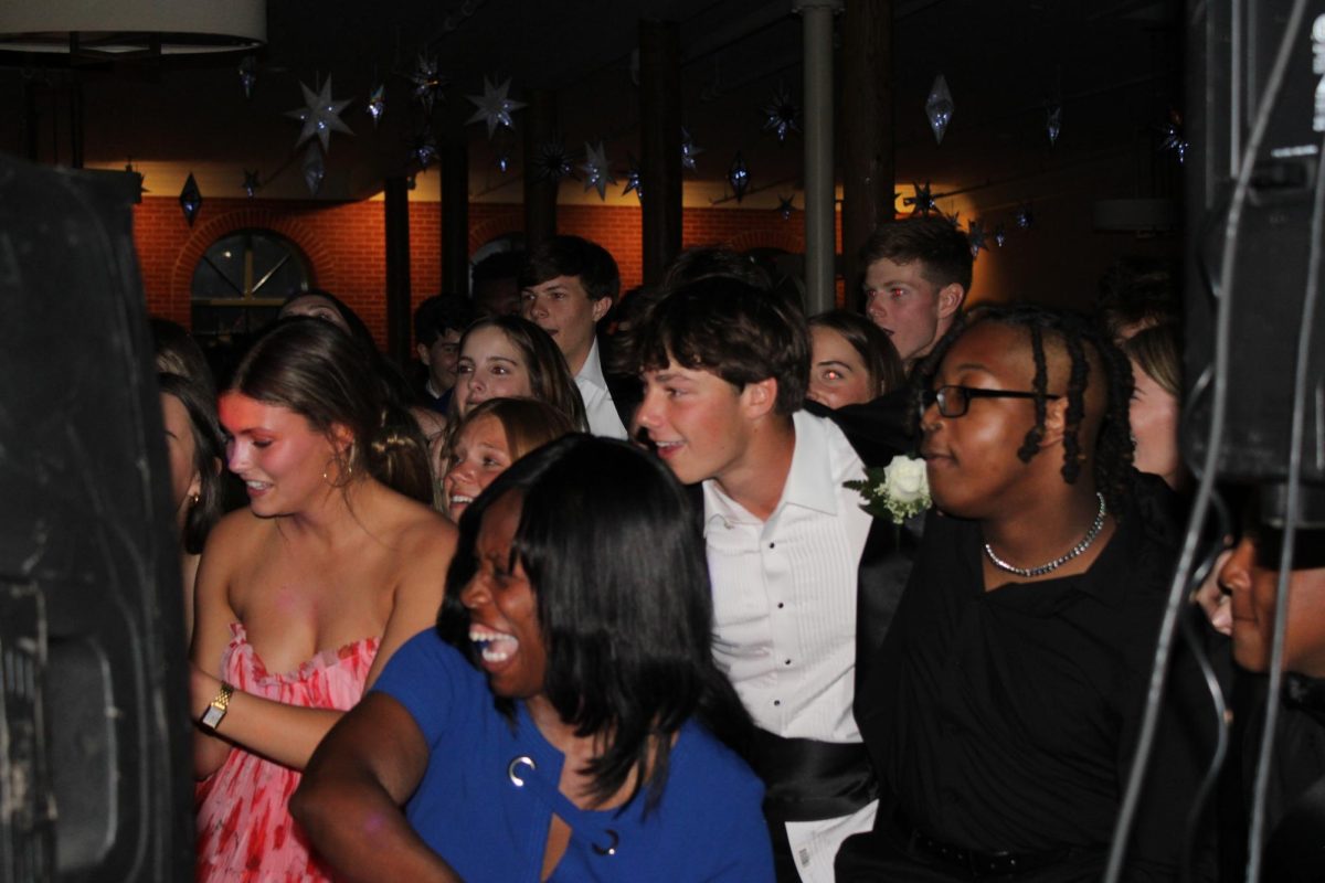 Students groove on the dance floor to a blend of classics and new hits.
