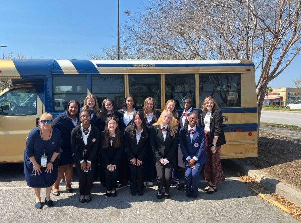 The HOSA chapter dressed up for competition day with sponsor Dr. Donna Howell.