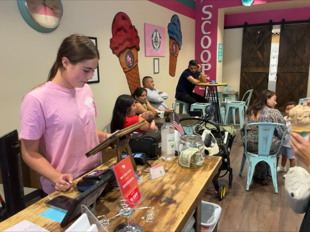 Mckenna Brown (10) works hard at the register of Hub City Scoops.