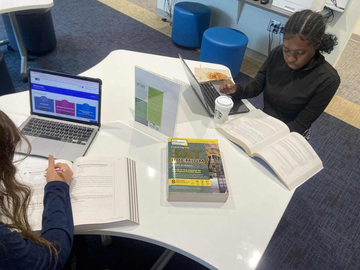 
Mikela Weir (12) and Jennifer Waddle  (12) using school provided ACT and SAT preparation books.
