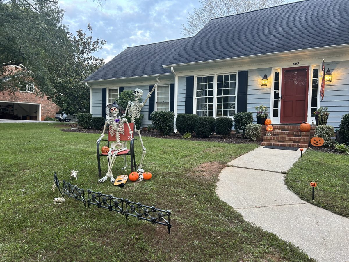 One way to get into the season is by decorating with funny skeletons and pumpkins.