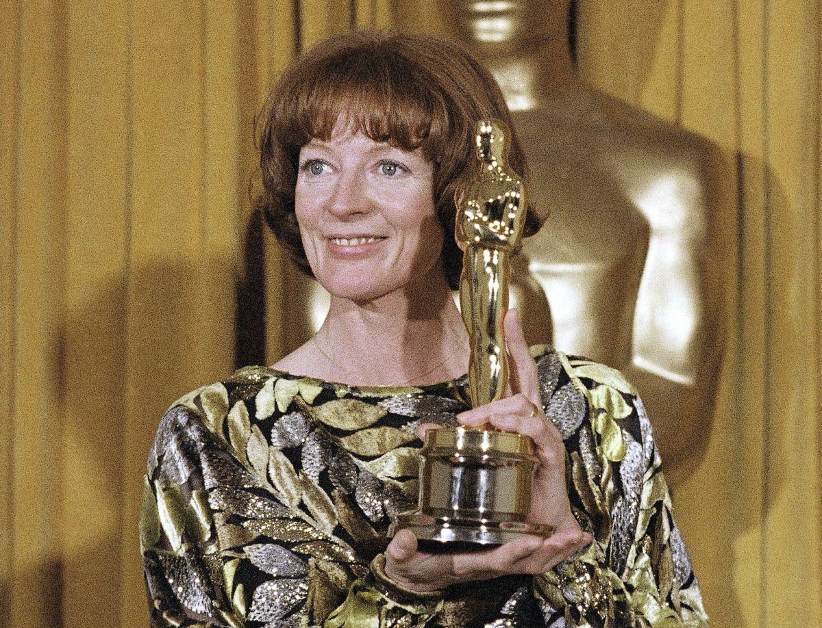 Maggie Smith holding up her first Grammy in 1994.