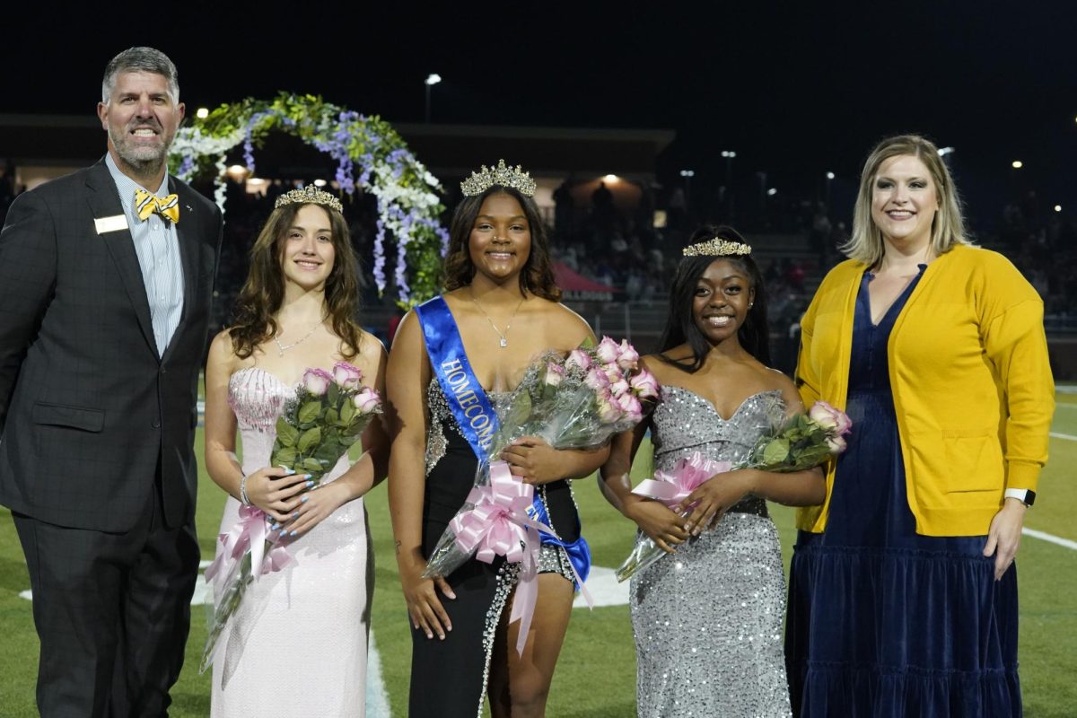 The winners pose with Principal Andrew McMillan and Student Council adviser Cassidy Holt.