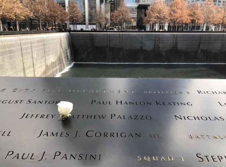 A victim of 9/11 is remembered with a white rose on his or her birthday at the memorial in New York City.