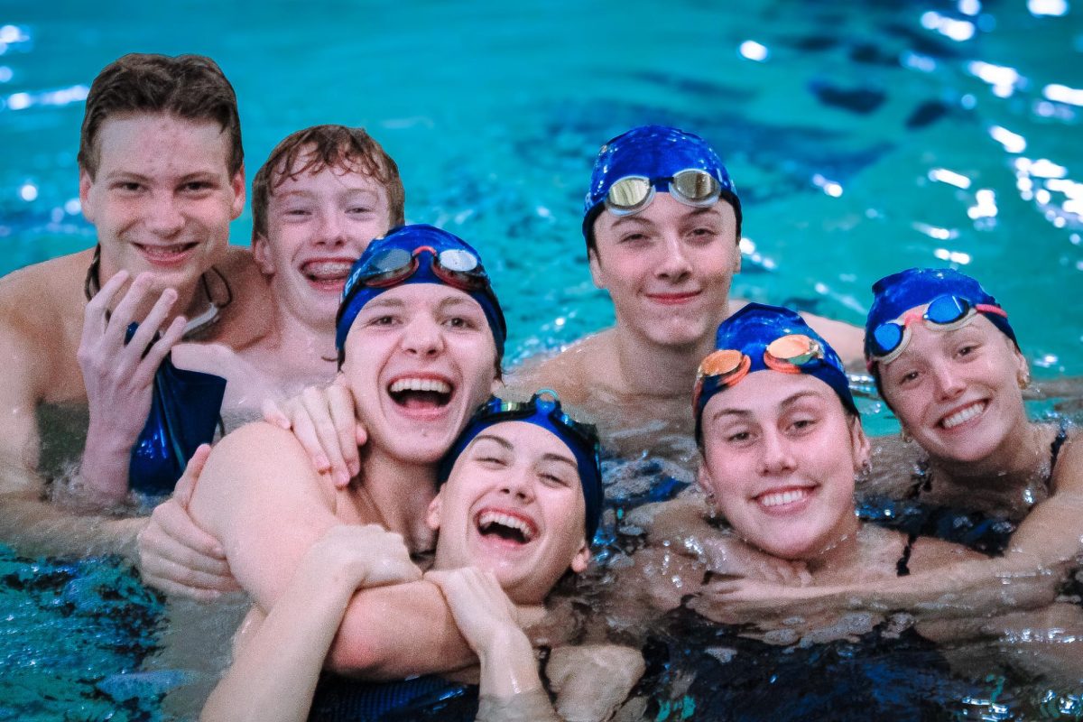 Spartanburg High School swimmers pose in the pool after finishing a tough race. 