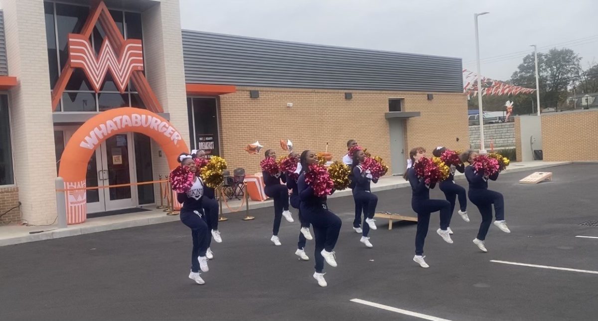 SHS cheerleaders help to celebrate the grand opening of Whataburger.