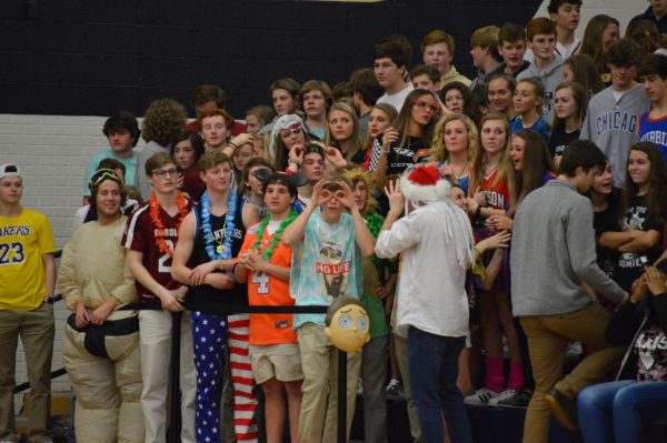 Bleacher Creatures bring energy and spirit, cheering on Spartan High Varsity Boys Basketball in 2019. 