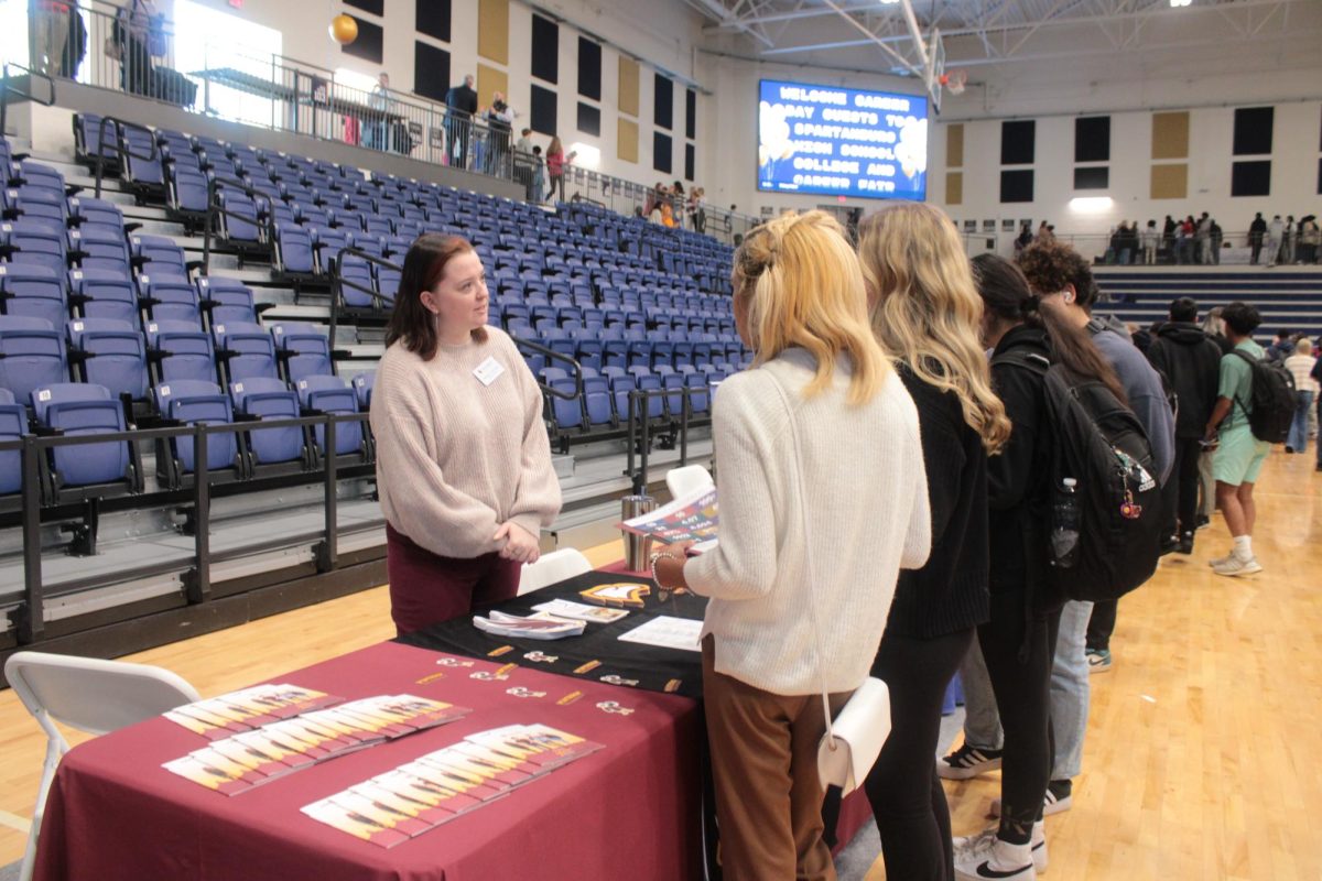 Spartanburg High School students meet with a college representative during the Spartanburg High School College and Career Fair.