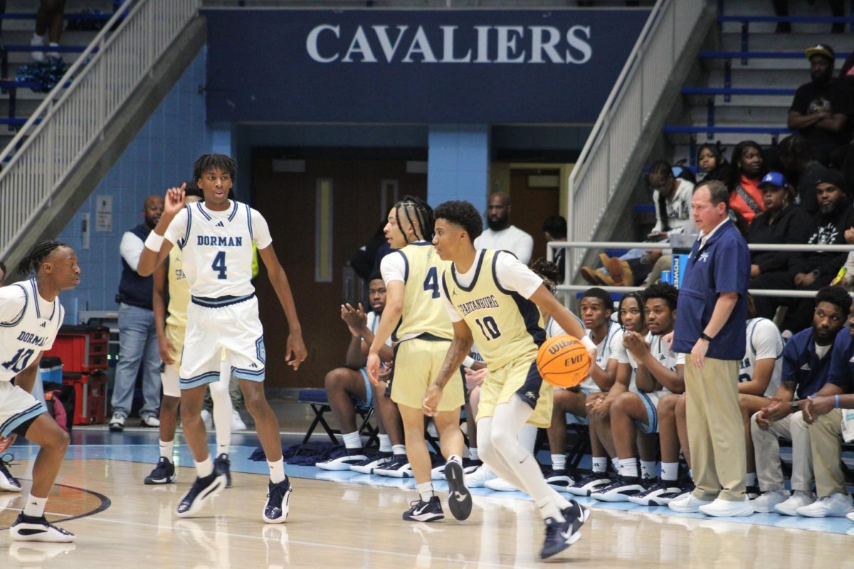 Imri Logan (10) gets ready to make a play with his teammates against Dorman.