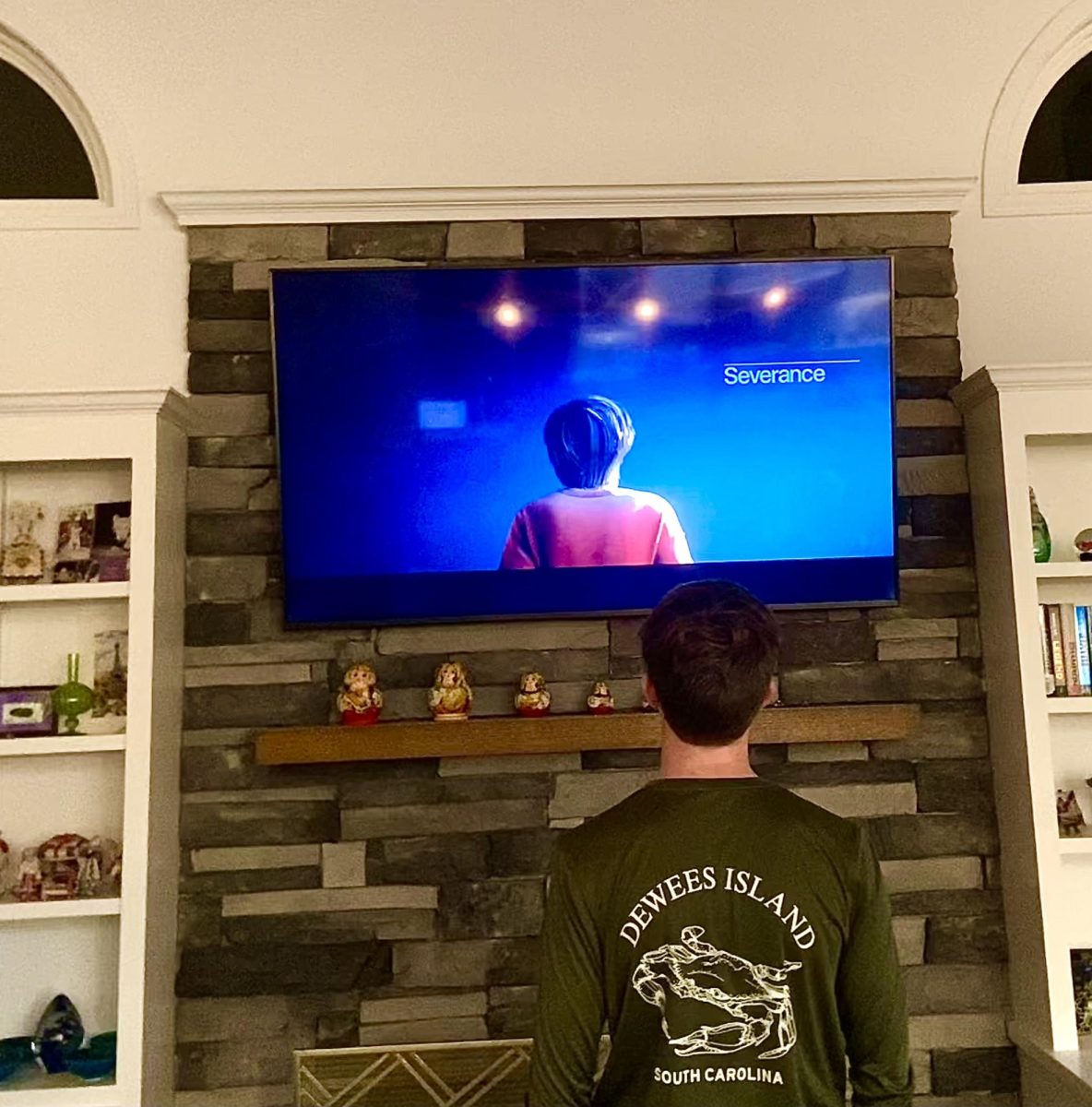 Benjamin Schafer (10) watches the introduction of newest episode of the second season of "Severance."