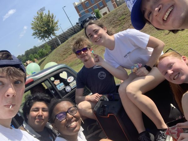 Seniors Ace Johnson, Danny Lacunza, Claire Hammond, Nalani Manigault, Sam Foster, Ellie Schafer, Mary Curtis, and Will Yeargin pile into Halle Abbott’s truck. waiting for the senior parade to start.  