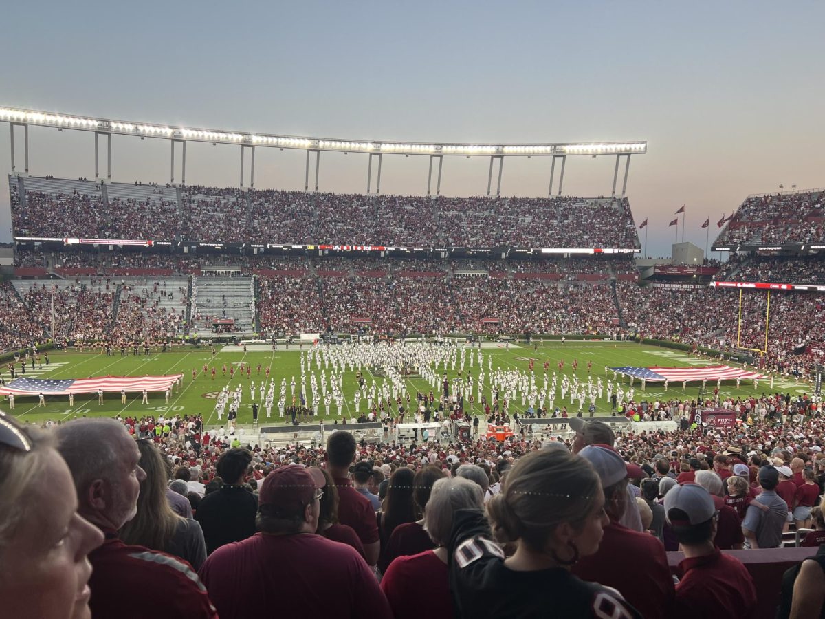 Under the glow of lights, the University of South Carolina competes against another team in the 2024 SEC season.
