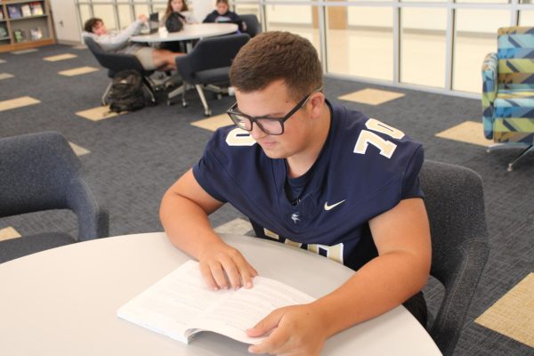 Taking a break from the rush of the first week, Ligon Martin (11) studies in the library.