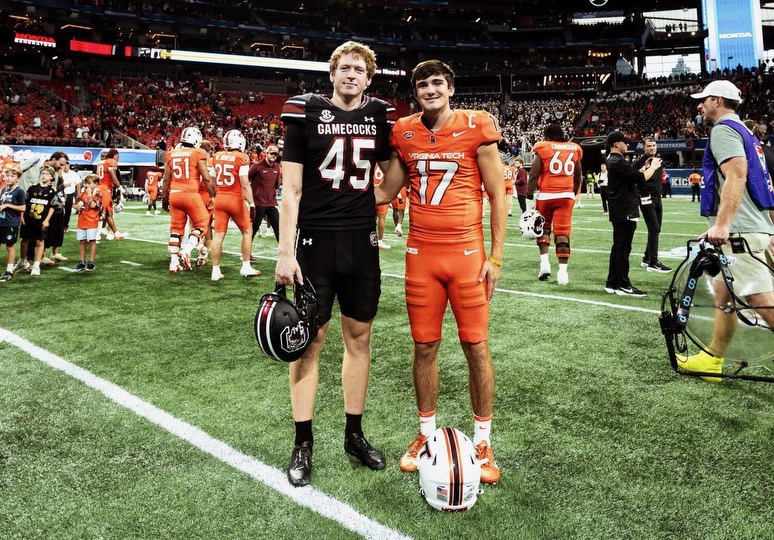 Spartanburg High alumni William Joyce and John Love reunite proudly, representing South Carolina and Virginia Tech on the national stage.