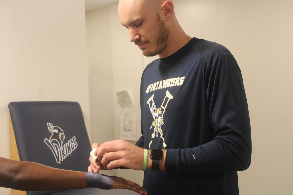 Trainers at Spartanburg High School are knowledgeable in various treatments to assist student athletes in their recovery and injury prevention.