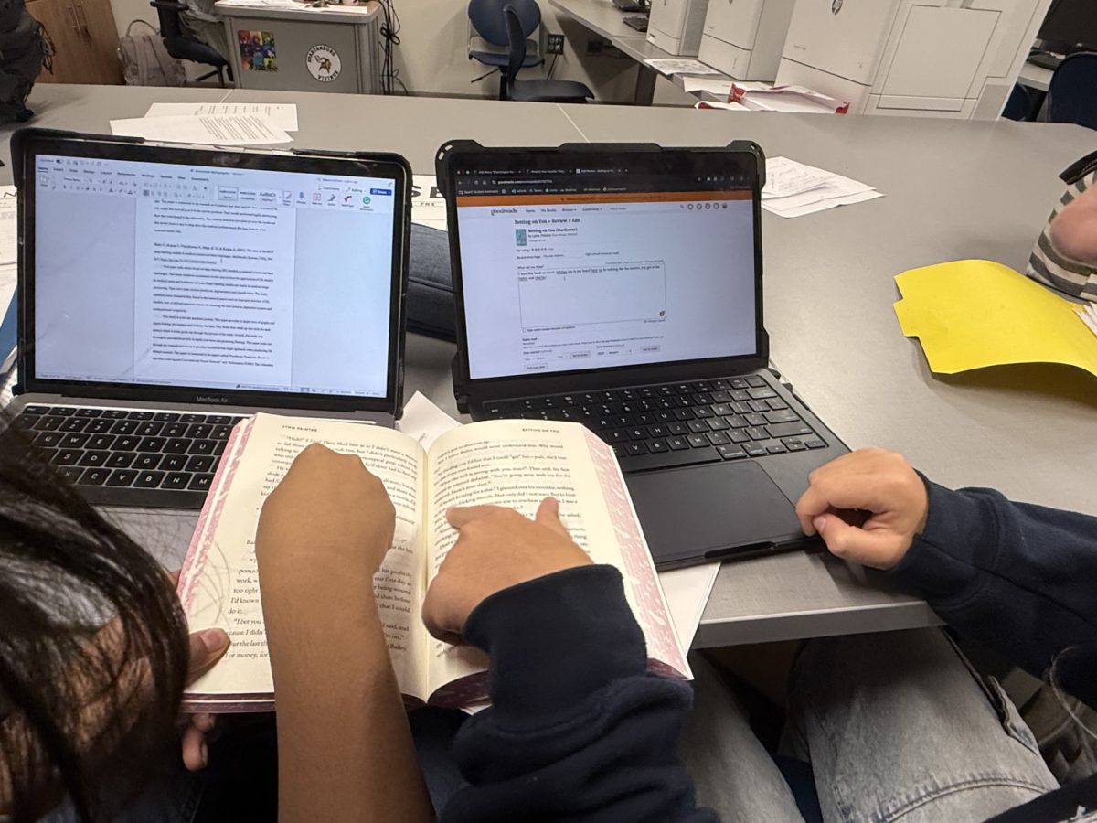 Two students write a book review of the book "Betting on You" by Lynn Painter on Goodreads.
