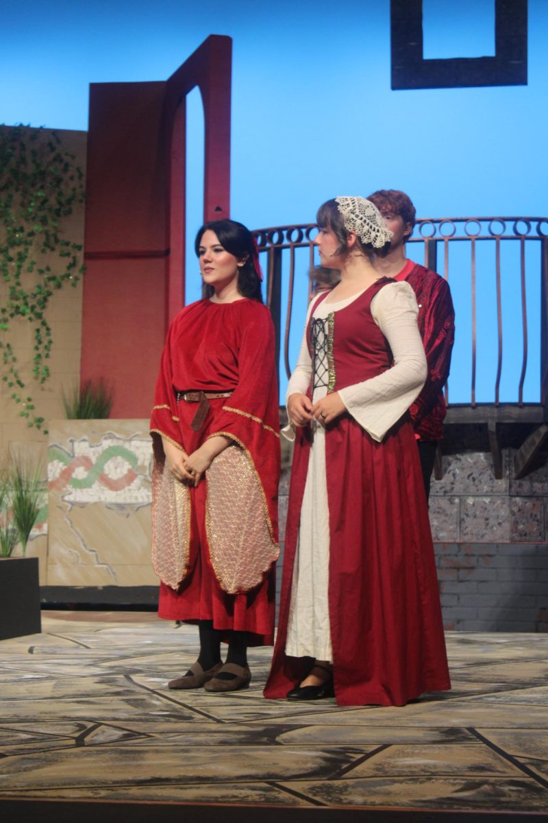 Madison Ruiz (12) and Sierra Shuford (11) practice a scene during dress rehearsal before the performance.