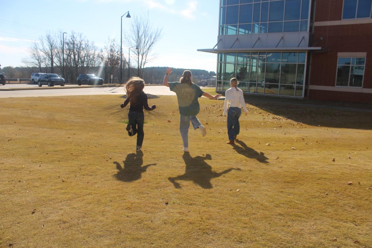 Students enjoying outside instead of looking on their phones or computers.
